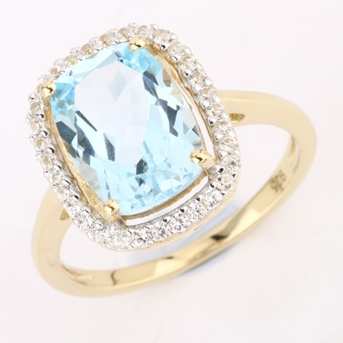 Ring: Blue Topaz Cushion 11x8mm: No Reserve! Title: Ring: Blue Topaz Cushion 11x8mm Description: Blue Topaz Cushion 11x8mm - 1Pcs + White Zircon Round 1.20mm - 32Pcs Date/Period: After 2000 Materials: 925 Silver W/Yellow Gold