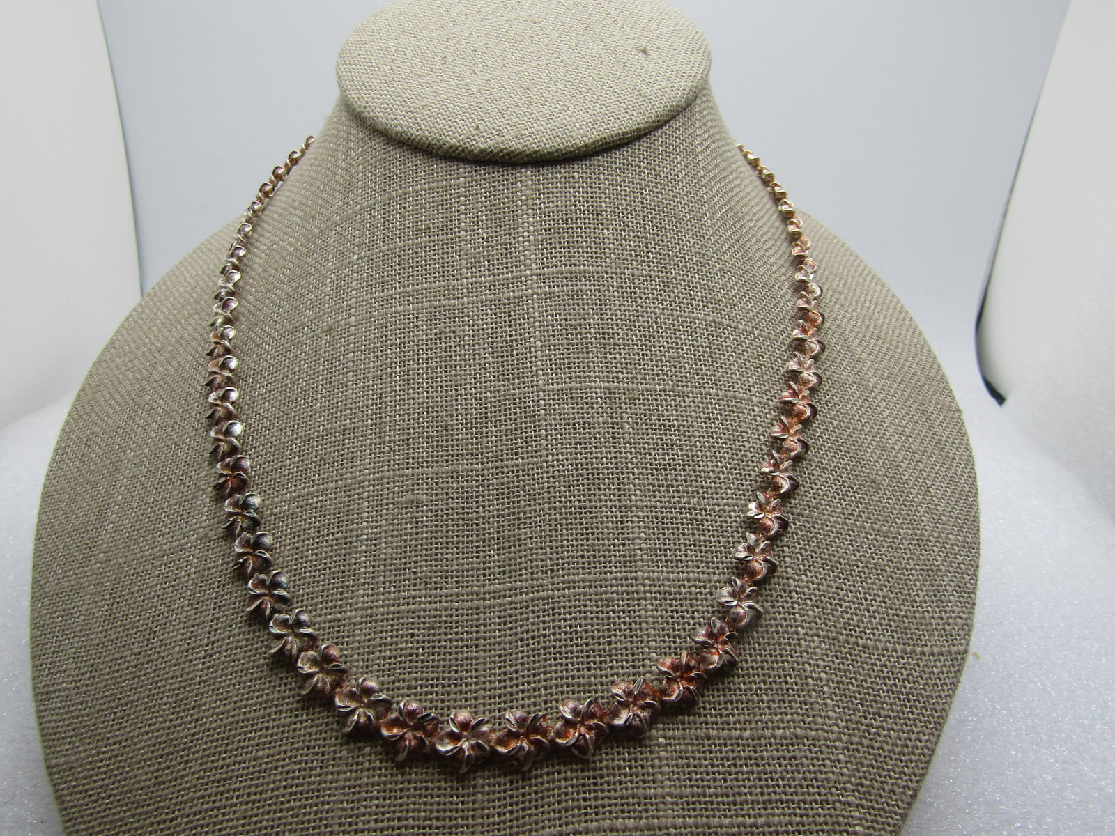 Vintage Sterling Plumeria Link Necklace, 18", 1990's, Signed: Vintage Sterling Plumeria Link Necklace, 18", 1990's. Each link is a plumeria blossom. It is appx. 6mm wide with lobster clasp where it is marked .925 and it tests as sterling too with an appx. weight