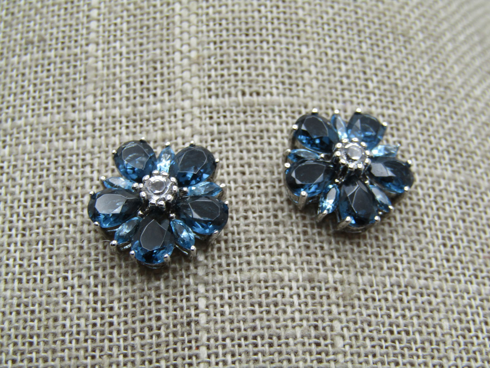 Sterling Blue & Clear CZ Earrings, Blossom, 1990's-2000's, Signed: Sterling Blue & Clear CZ Earrings, Blossom, 1990's-2000's, Signed SAI, marked .925 and test as silver with a weight of 3.96 gr, including stones. Photos do not show the clutches but they have