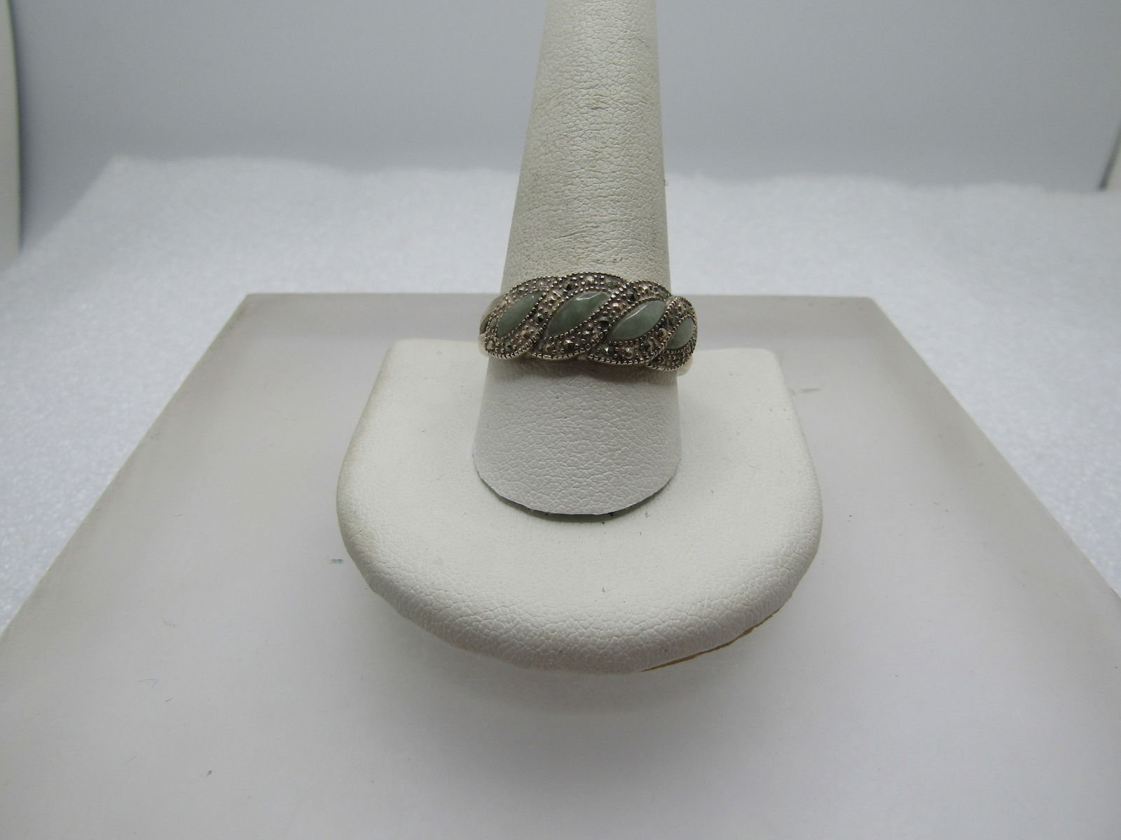Vintage Sterling Green Agate/Marcasite Ring, Sz. 11.5, 1980's-1990's, Signed: Vintage Sterling Green Agate/Marcasite Ring, Sz. 11.5, 1980's-1990's, Signed N.V. and marked .925 and tests as sterling with a weight of appx. 4.84 gr. . It has four light green cateye shaped