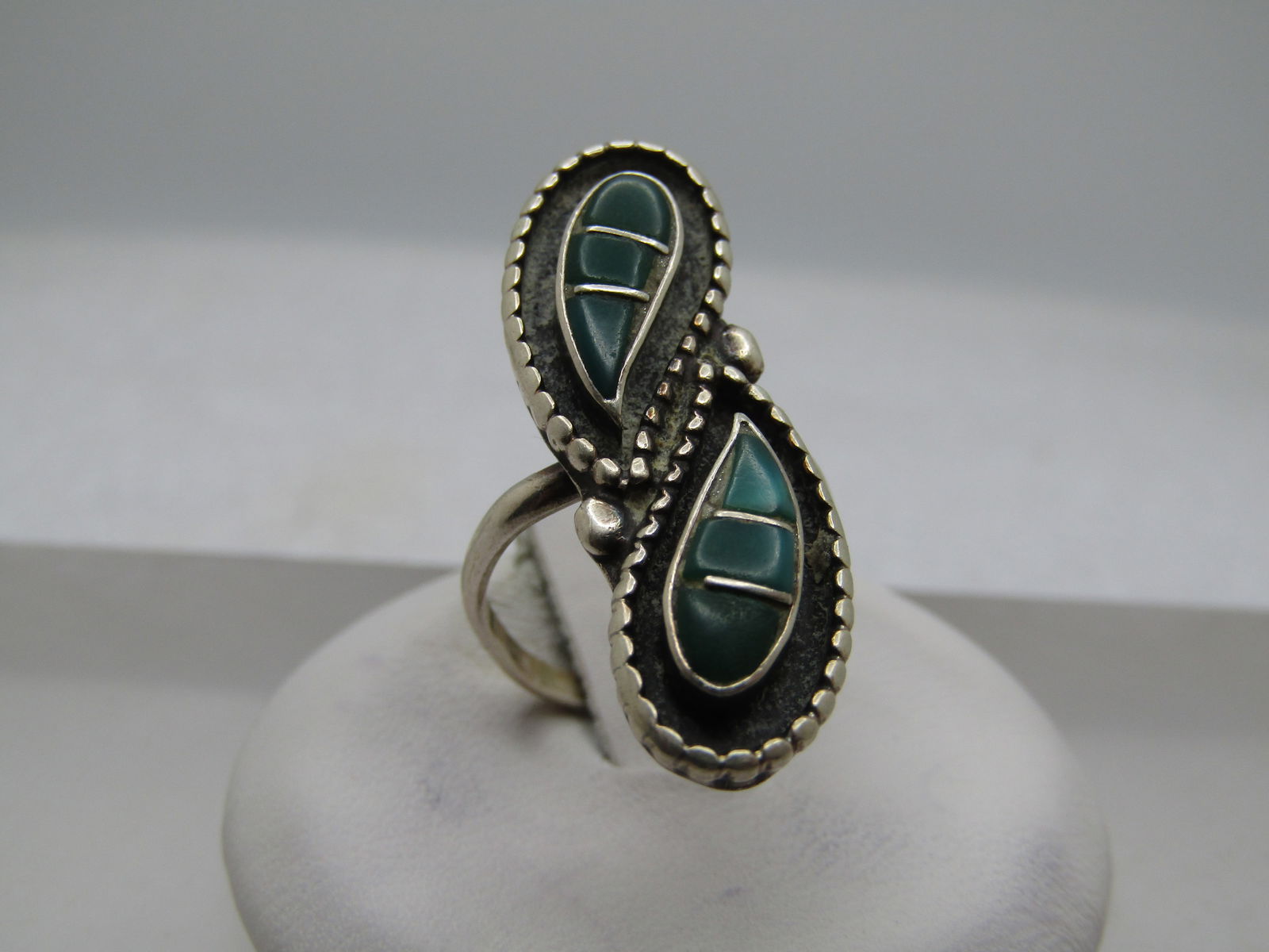 Vintage Sterling Southwestern Chryosprase Bypass Ring, Sz. 5.5, 1970's-1980's: Vintage Sterling Southwestern Chryosprase Bypass Ring, Sz. 5.5, 1970's-1980's. This has two tear-drop shadowbox style details with green chryosprase inliad in three bezel-set teardrop sections set
