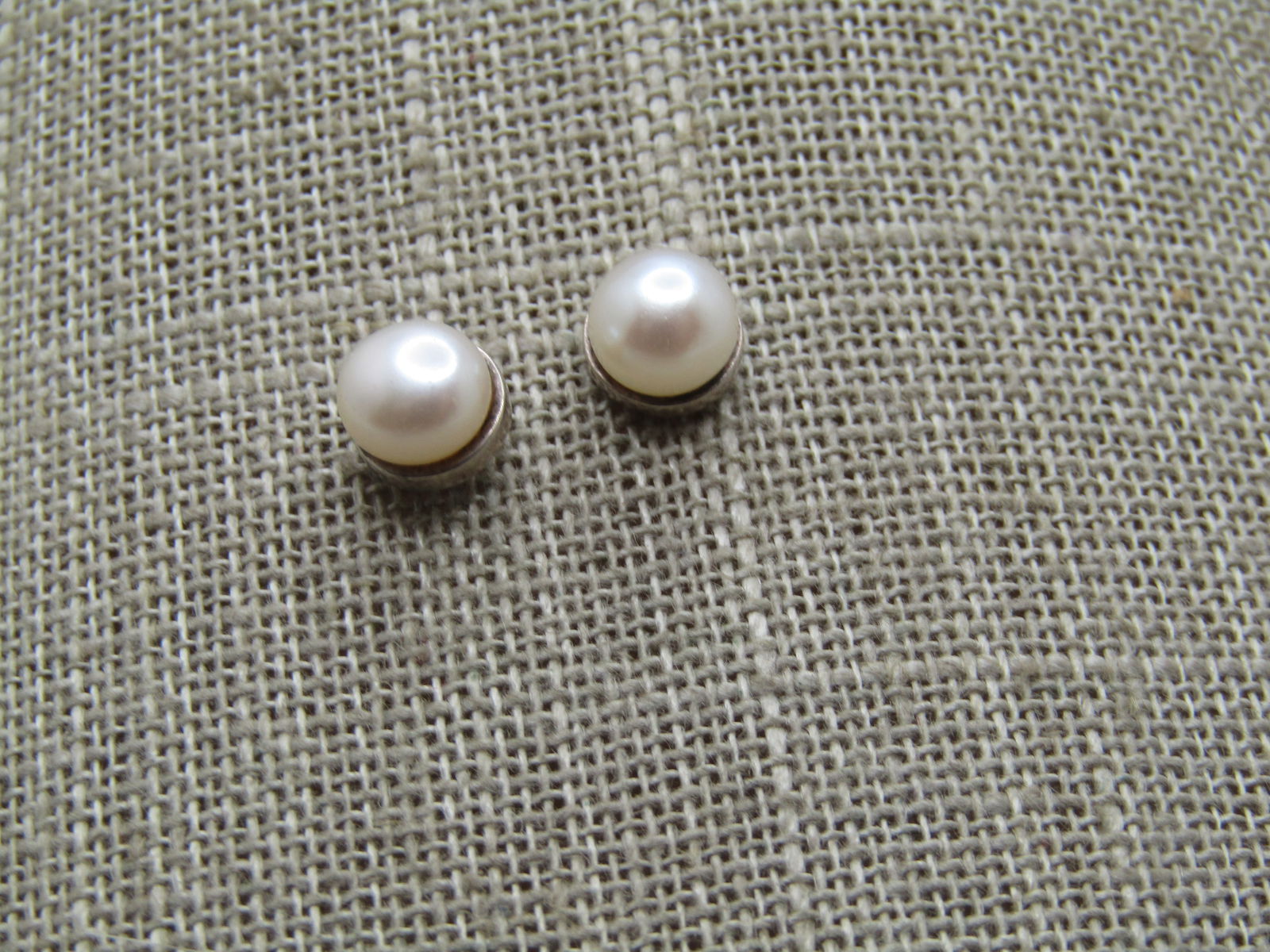 Vintage Sterling 6mm Cultured Pearl Earrings, 1980's: Vintage Sterling 6mm Cultured Pearl Earrings, 1980's. The pearls are appx. 6mm and believed to be cultured with a squatty look. The clutches are not sterling but the posts are marked sterling and test