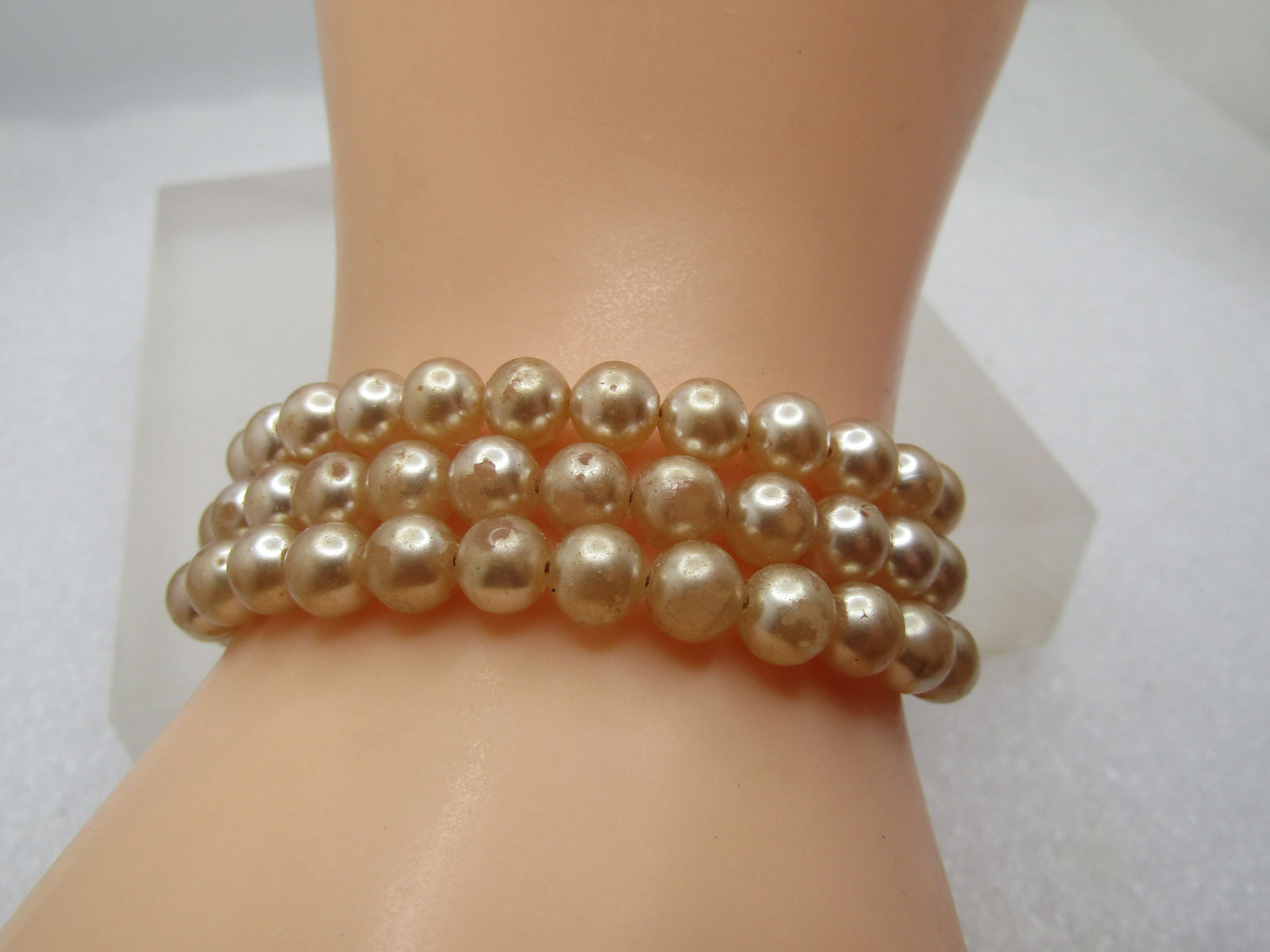 Vintage Sterling Faux Pearl Bracelet, Triple Strand, 1940's, 7.5", Signed: Vintage Sterling Faux Pearl Bracelet, Triple Strand, 1940's, 7.5", Signed but unkown. 6mm blush colored faux pearls, tripe strand with a filigree sterling box clasp where it is marked sterling and