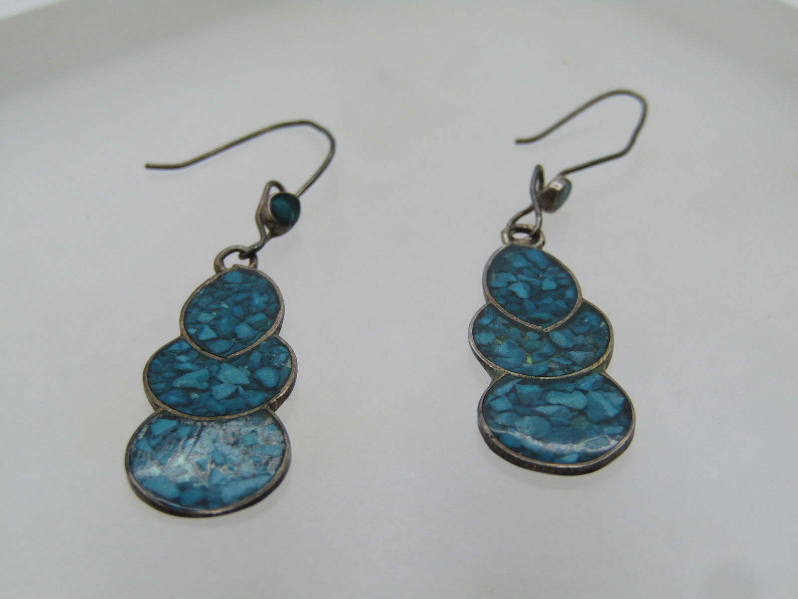 Vintage Sterling Inlaid Turquoise Chip Earrings, Pierced, Southwestern, 1960's-1970's: Vintage Sterling Inlaid Turquoise Chip Earrings, Pierced, Southwestern, 1960's-1970's. Hook posts with hook lock. On the end of the post closest to the drop there is a round inlaid chip accent that