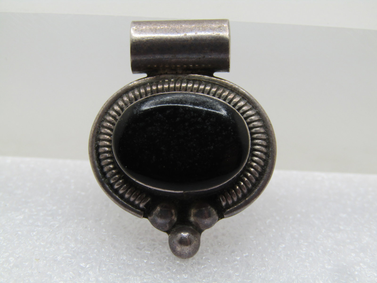 Vintage Sterling Southwestern Faux Onyx Slide, Mexico 1980's-1990's: Vintage Sterling Southwestern Faux Onyx Slide, 1980's-1990's. Marked Mexico. and signed with an H. Marked .925 and tests as sterling with a weight of appx. 10.07 gr. Oval black resin stone bezel-set t