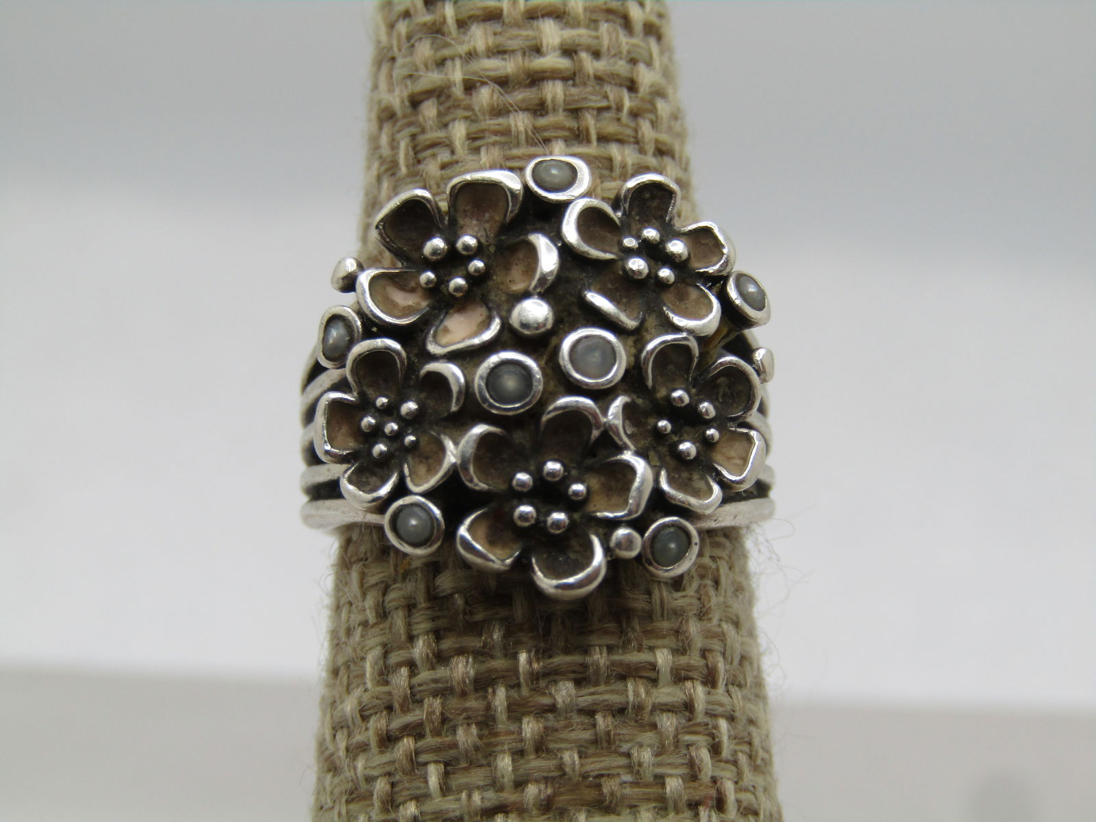 Vintage Sterling Floral ring, Sz. 5.25, Danish Modernish Algot Enevoldsen, 1950's: Vintage Sterling Floral ring, Sz. 5.25, Danish Modernish Algot Enevoldsen, 1950's. Five bands support this round cluster of floral blossoms with bezel-set round pearl-like stones. there are five bloss
