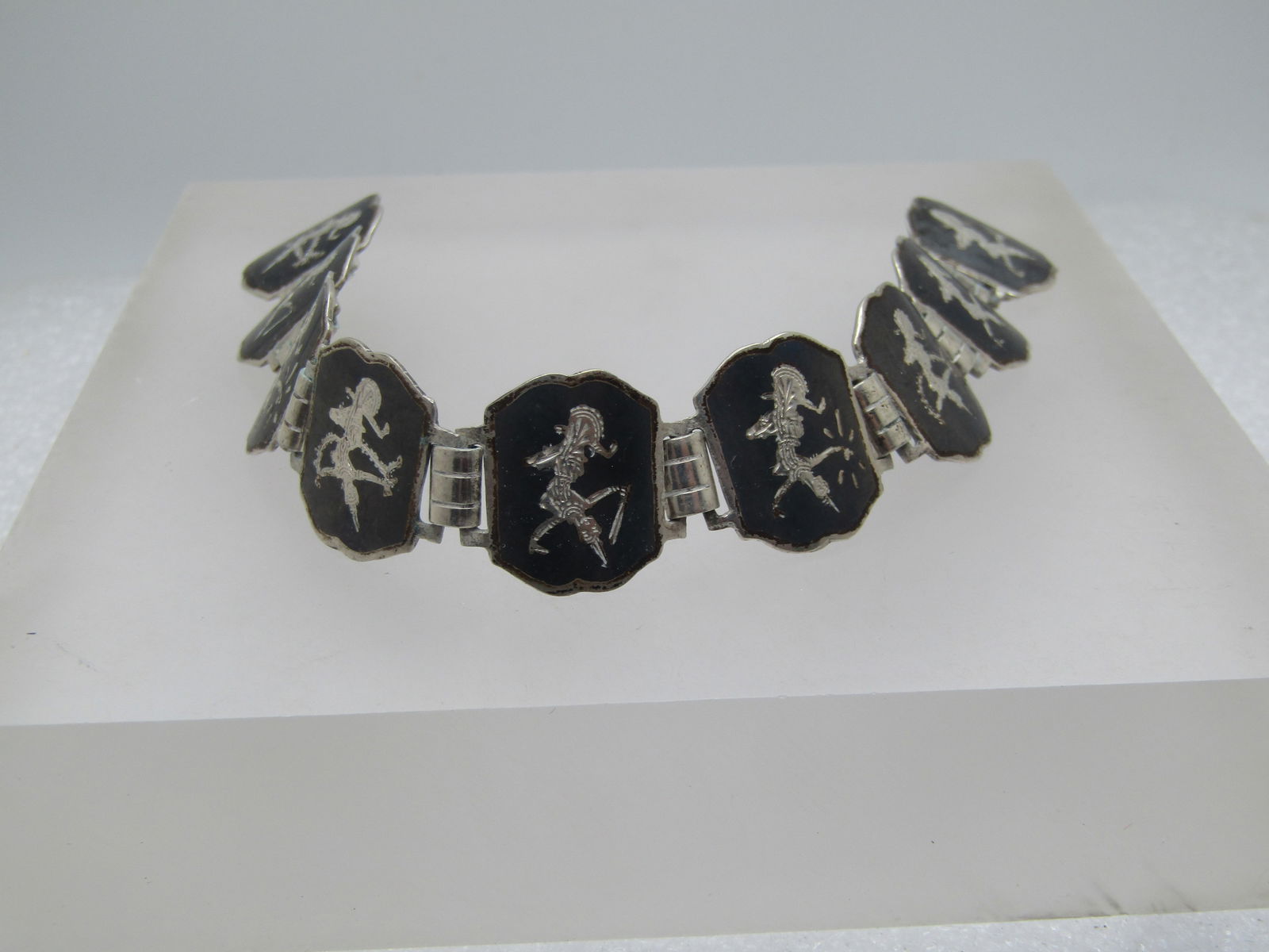 Vintage Sterling Siam/Niello Bracelet, 6.25", 1940's-1950's, Needs Clasp: Vintage Sterling Siam/Niello Bracelet, 6.25", 1940's-1950's. Black enameled tiles with the Siam dancing goddess on each tile. The tiles are appx. 3/4" wide. This has a box clasp which is missing