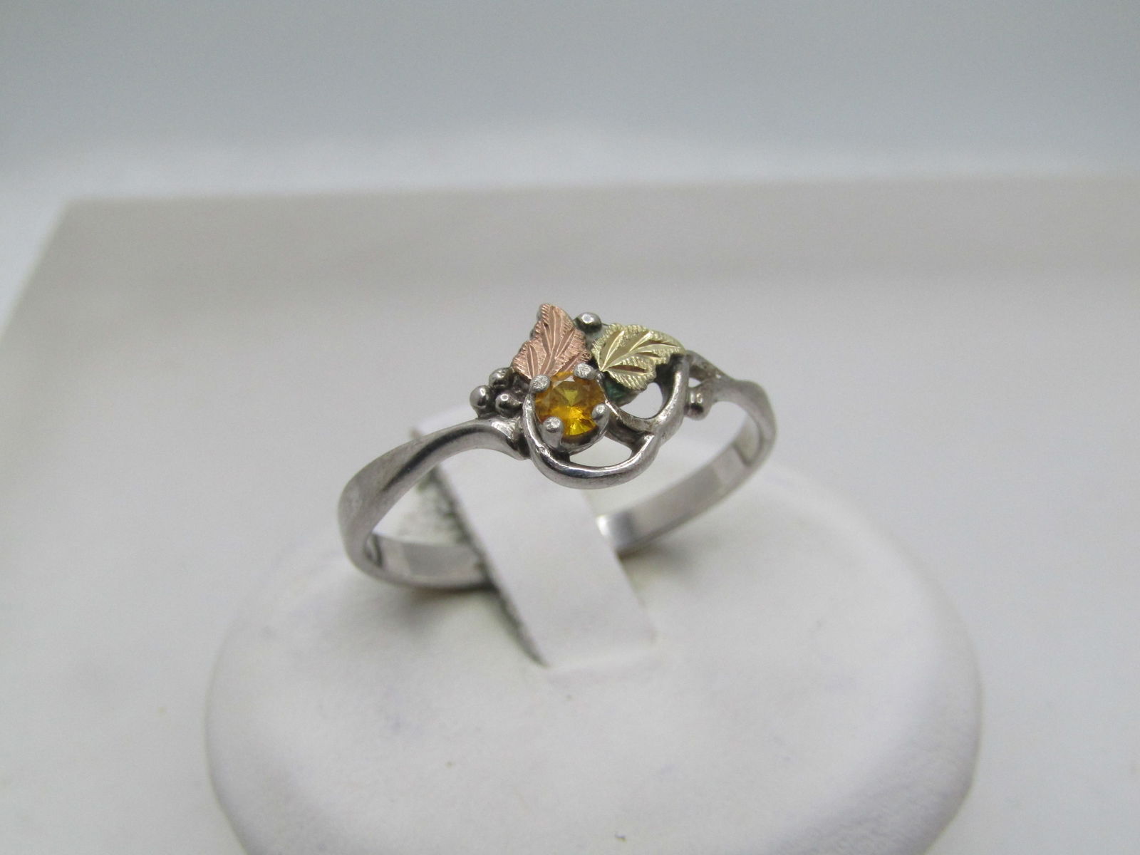 Vintage Sterling & 12kt Citrine Ring, Black Hills Gold. Signed Landstrom, 1990's. Sz. 10.25: Vintage Sterling & 12kt Citrine Ring, Black Hills Gold. Signed Landstrom, 1990's. Sz. 10.25. This has a 12kt yellow gold leaf and rose gold leaf with open scroll frame and a raised citrine that is