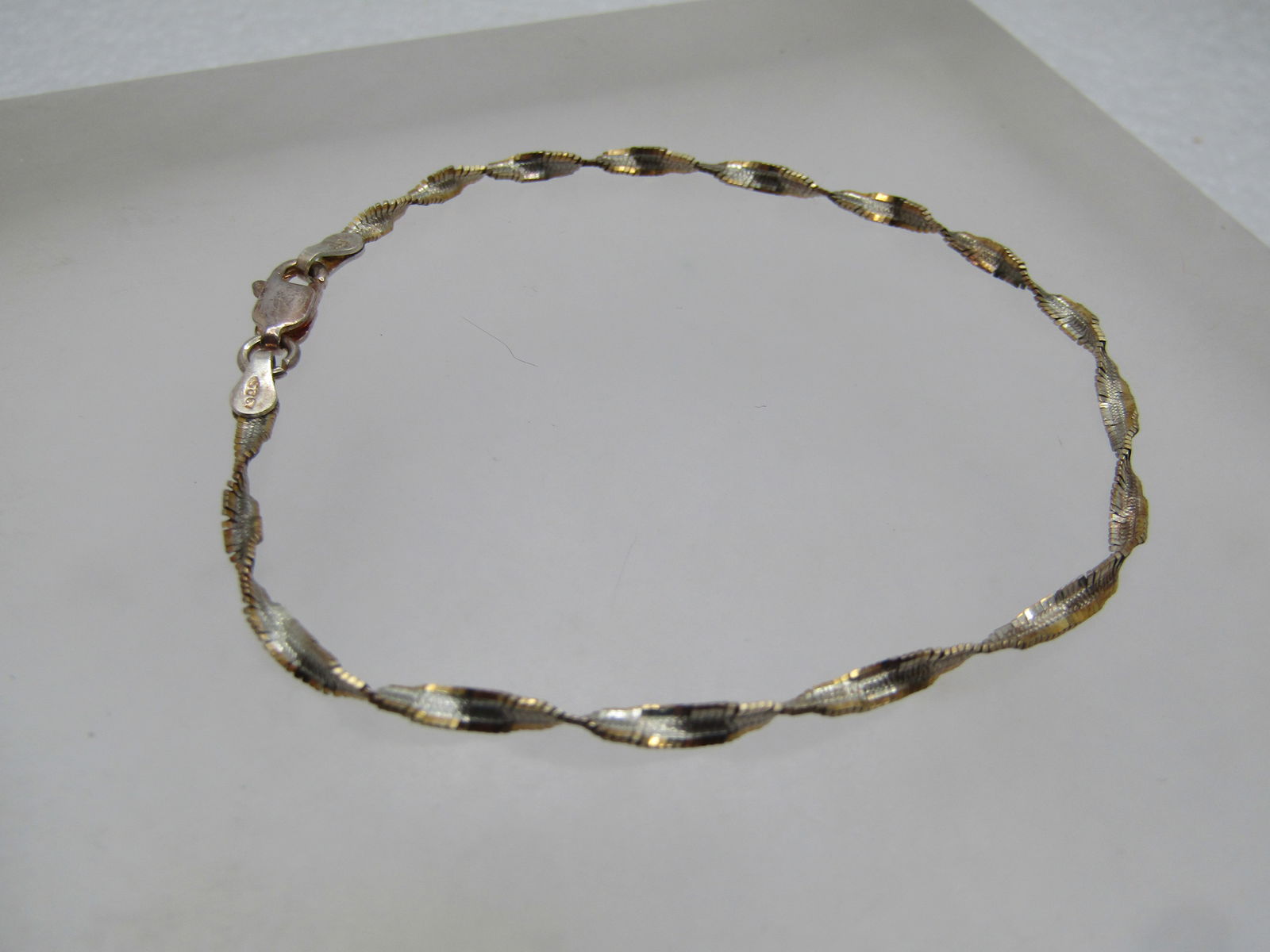 Vintage Sterling Twisted Herringbone Bracelet, 7.5", Italy, 1980's-1990's, Signed PT: Vintage Sterling Twisted Herringbone Bracelet, 7.5", Italy, 1980's-1990's, Signed PT. It is appx. 2.5mm wide with lobster clasp. It is marked .925 and tests as sterling with a weight of appx. 2.06