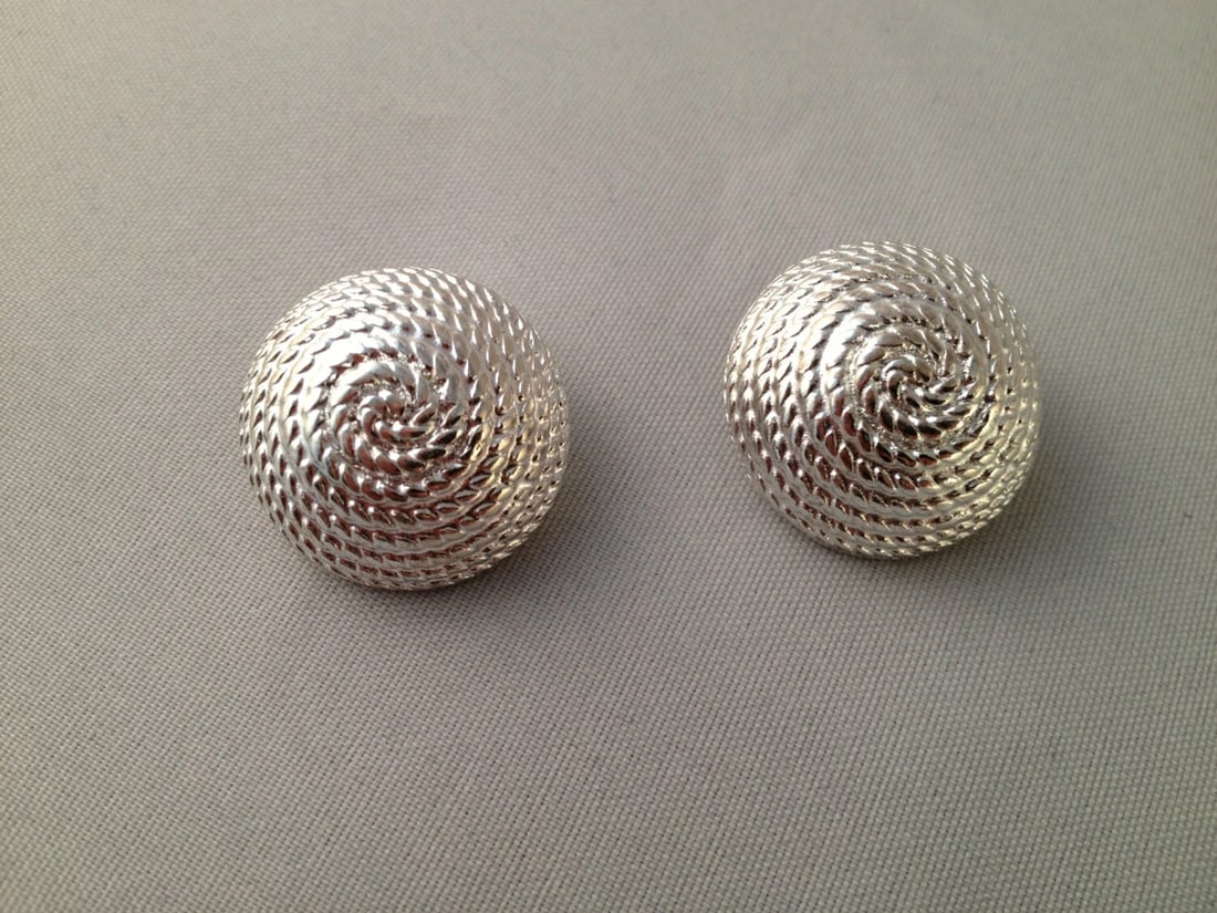 Givenchy Rope Round Earrings: Title:Givenchy Rope Round EarringsDescription:A classic pair of Givenchy earrings with a rope and dome design in slivertone. Made in the 1980's. Earrings measure 21 mm's in diameter and have a