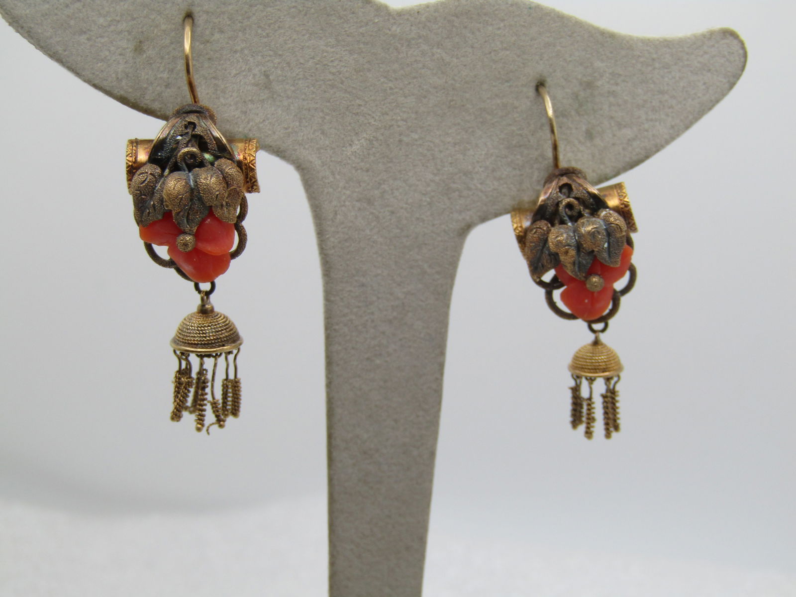 Antique 14kt Carved Coral Earrings, Pierced: Title:Antique 14kt Carved Coral Earrings, PiercedDescription:Antique 14kt Carved Coral Earrings, Pierced. These have grape-like leaves over a triple petal carved coral blossom with a tassel dangle