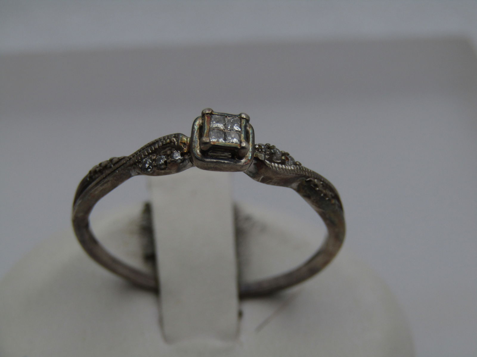 Sterling Diamond Engagement Ring, .21 TCW Signed IKS, Sz. 11: Title:Sterling Diamond Engagement Ring, .21 TCW Signed IKS, Sz. 11Description:Sterling Diamond Engagement Ring, .21 TCW Signed IKS, Sz. 11. Sold in December 2013 through Zales . Four diamonds set