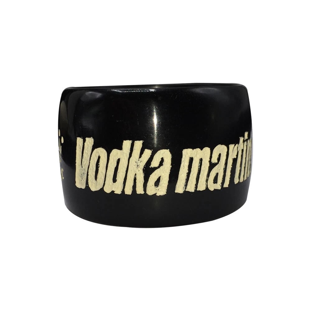 Jessica Kagan Cushman Black Resin Bangle Vodka Martini: Title:Jessica Kagan Cushman Black Resin Bangle Vodka MartiniDescription:Jessica Kagan Cushman resin black bangle : Vodka martini Shaken, not stirred. Signed, JCK and Jessica Kagan Cushman. Measures 1