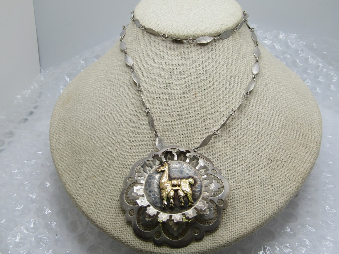 Vintage Sterling & 18kt Llama Filigree Necklace, Peru, 24": Title:Vintage Sterling & 18kt Llama Filigree Necklace, Peru, 24"Description:Vintage Sterling & 18kt Llama Filigree Brooch/Necklace, Peru, 24". The pendant can be used as a pendant or as a brooch. 