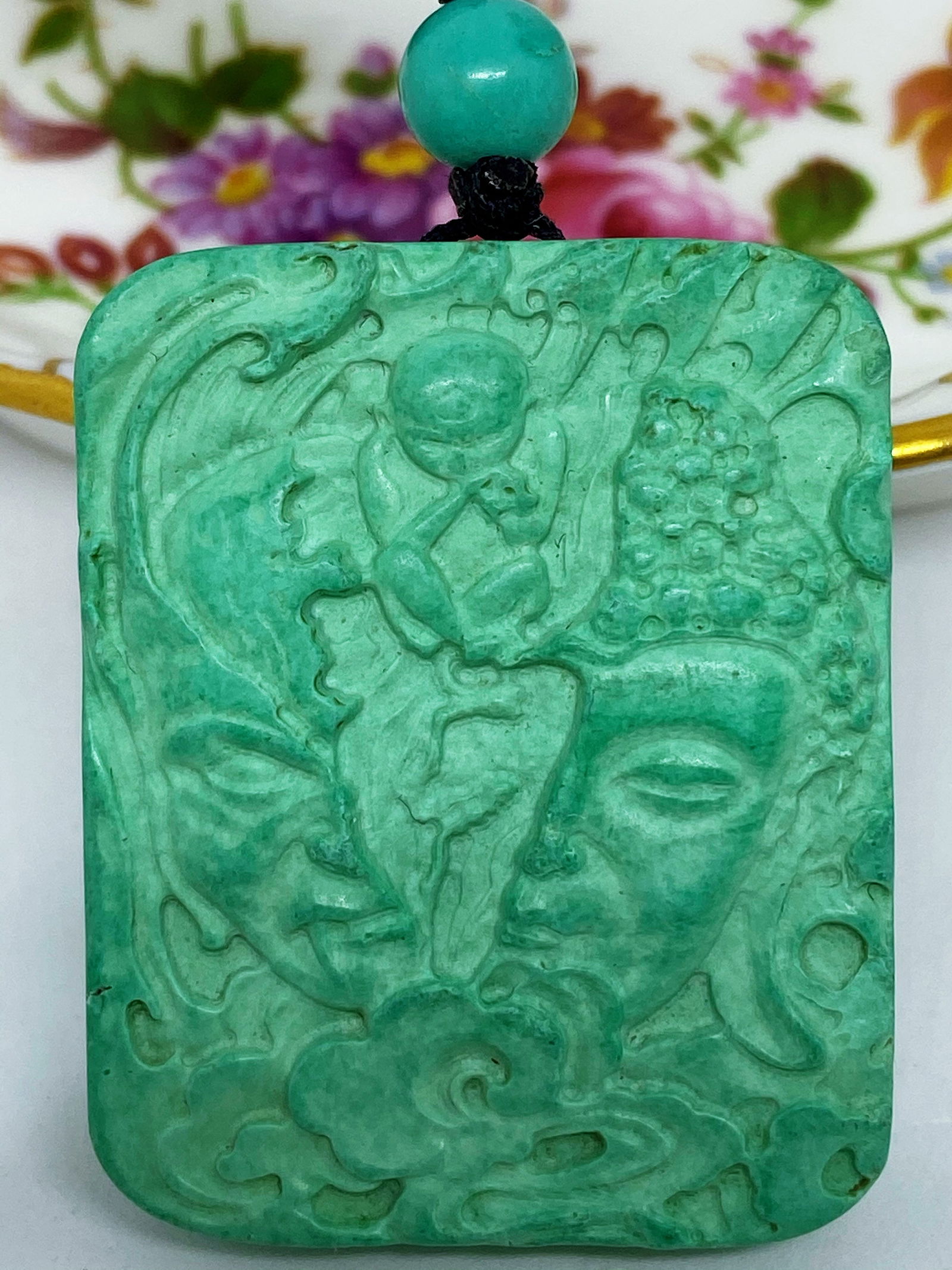 Chinese Hand Carved Turquoise Buddha-Evil Head Amulet Figure: Title:Chinese Hand Carved Turquoise Buddha-Evil Head Amulet FigureDescription:Chinese Hand Carved Turquoise Buddha-Evil Head Amulet Figure This gorgeous piece of Greenish blue Turquoise Stone Hand