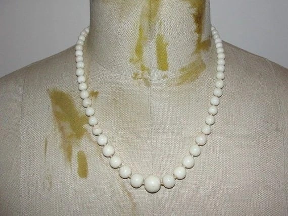 Graduated Angel Skin Coral Necklace Sterling Silver Etched Button Coral Clasp: Title:Graduated Angel Skin Coral Necklace Sterling Silver Etched Button Coral ClaspDescription:Amazing coral with great white coral, very little pink. Circa 1940's. Beads graduate from 5 mm's to 13