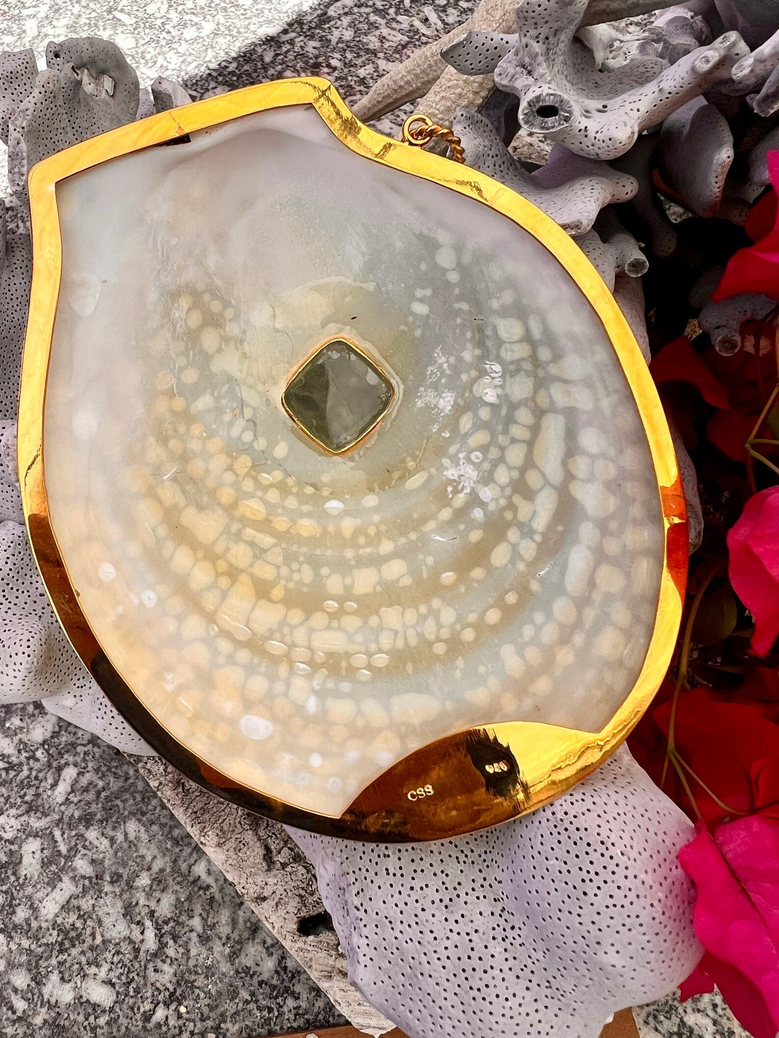 Acesta Rathbuni Shell Pendant with Aquamarine: Title:Acesta Rathbuni Shell Pendant with Aquamarine Description:A magnificent Acesta Rathbuni Shell, framed with 18-karat Gold Vermeil, with a twisted ring and set an included Green Aquamarine. The on