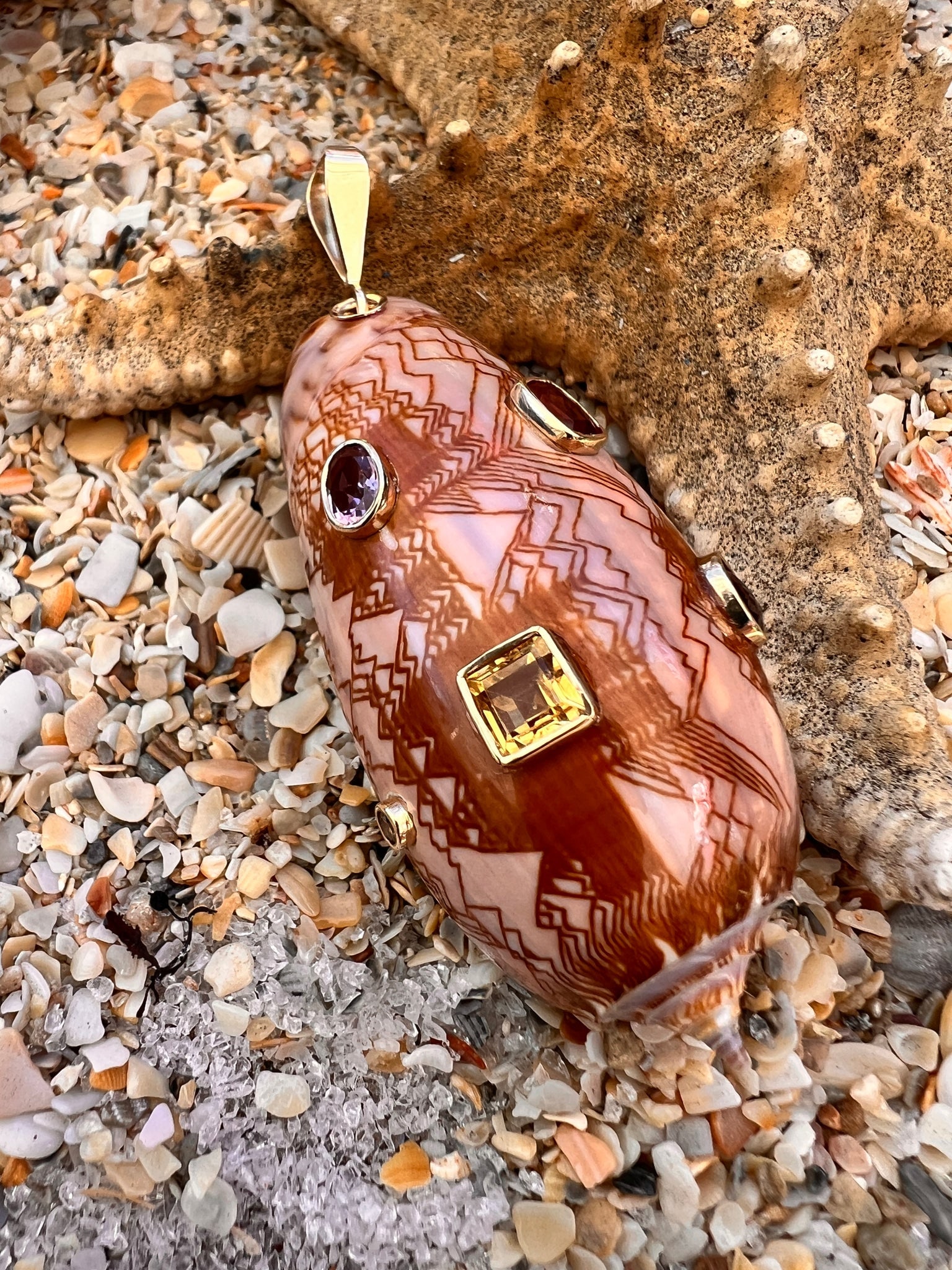 14-karat Gold Volute Shell Pendant with Citrine: Title:14-karat Gold Volute Shell Pendant with Citrine Description:Fancy Volute Shell decked out with glittery golden and beer Citrine - Signed CSS - 14-karat Gold - 3" long Reserve: $2,160.00 Shipping