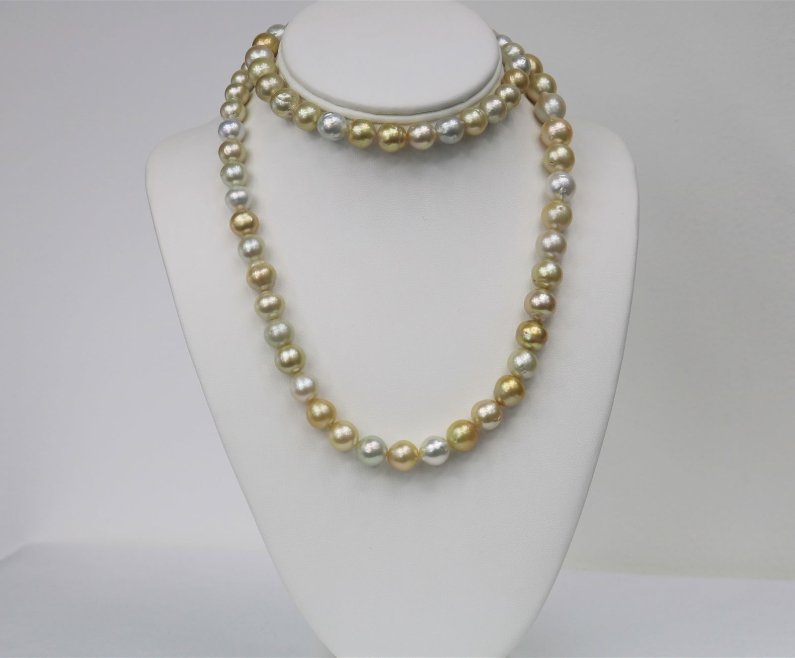 8-13mm South Sea White and Gold Near Round Long Necklace with 14k Clasp: Title:8-13mm South Sea White and Gold Near Round Long Necklace with 14k Clasp Description:White and Golden South Sea Near Round Multi Color Long Necklace, 73 pearl pieces, 34 inches hand knotted with