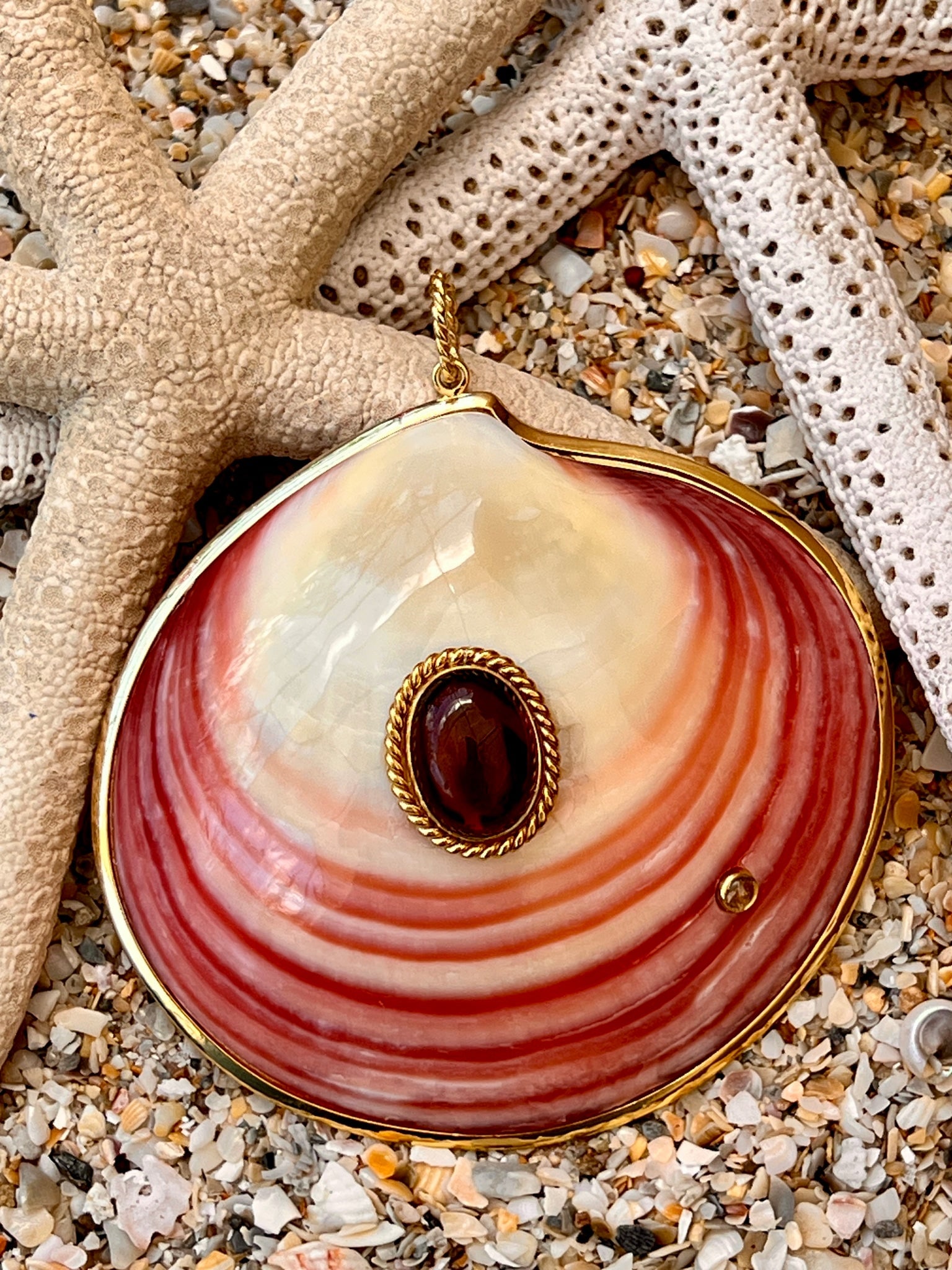 Pink Tiger Clam Pendant with Pink Tourmaline: Title:Pink Tiger Clam Pendant with Pink Tourmaline Description:Beautiful Tiger Clam Pendant set with a large Pink Tourmaline cabochon and a sapphire - Signed CSS - Vermeil -3.5" across Reserve: $716.0