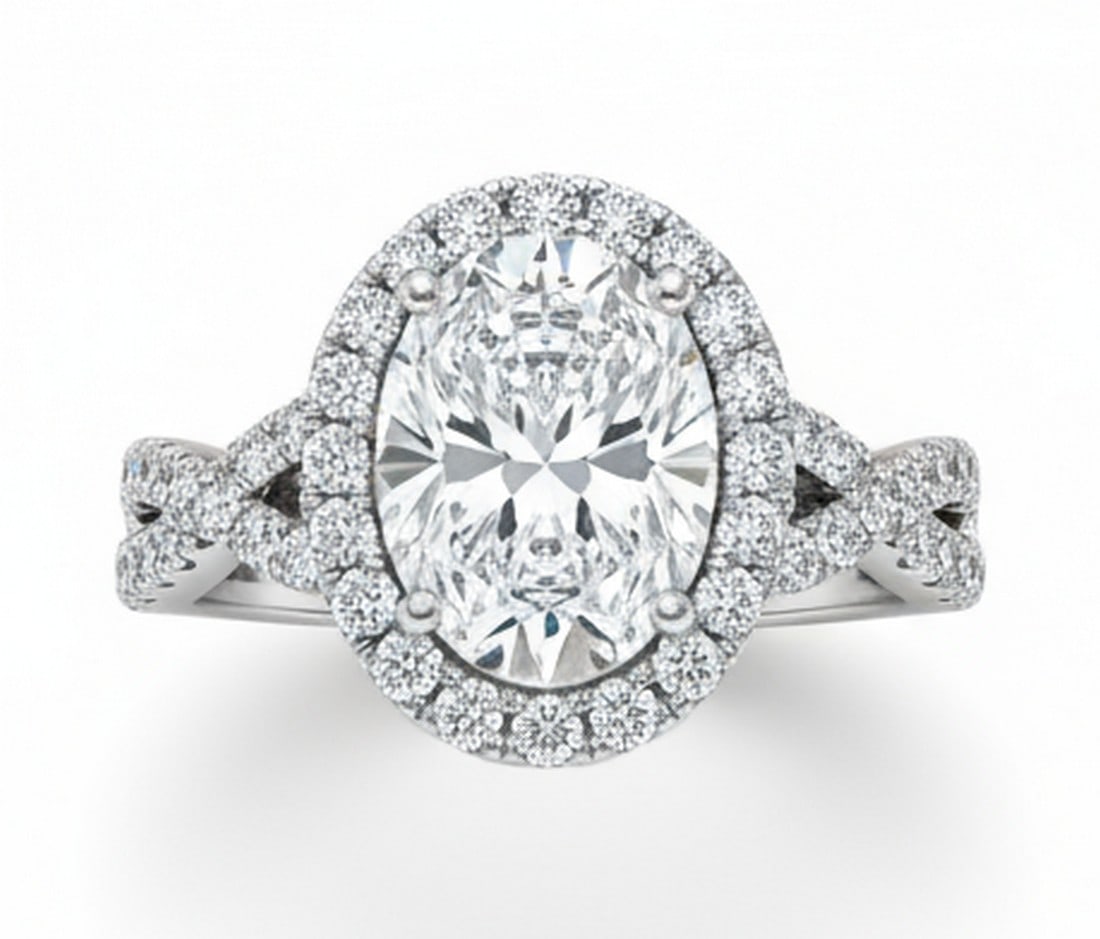 4.00 CT Oval lab-grown diamond Diamond Twist-Shank Halo Engagement Ring in 14K White Gold: Title: 4.00 CT Oval lab-grown diamond Diamond Twist-Shank Halo Engagement Ring in 14K White Gold Description: This romantic engagement ring features a 4.00 carat oval lab-grown diamond diamond framed