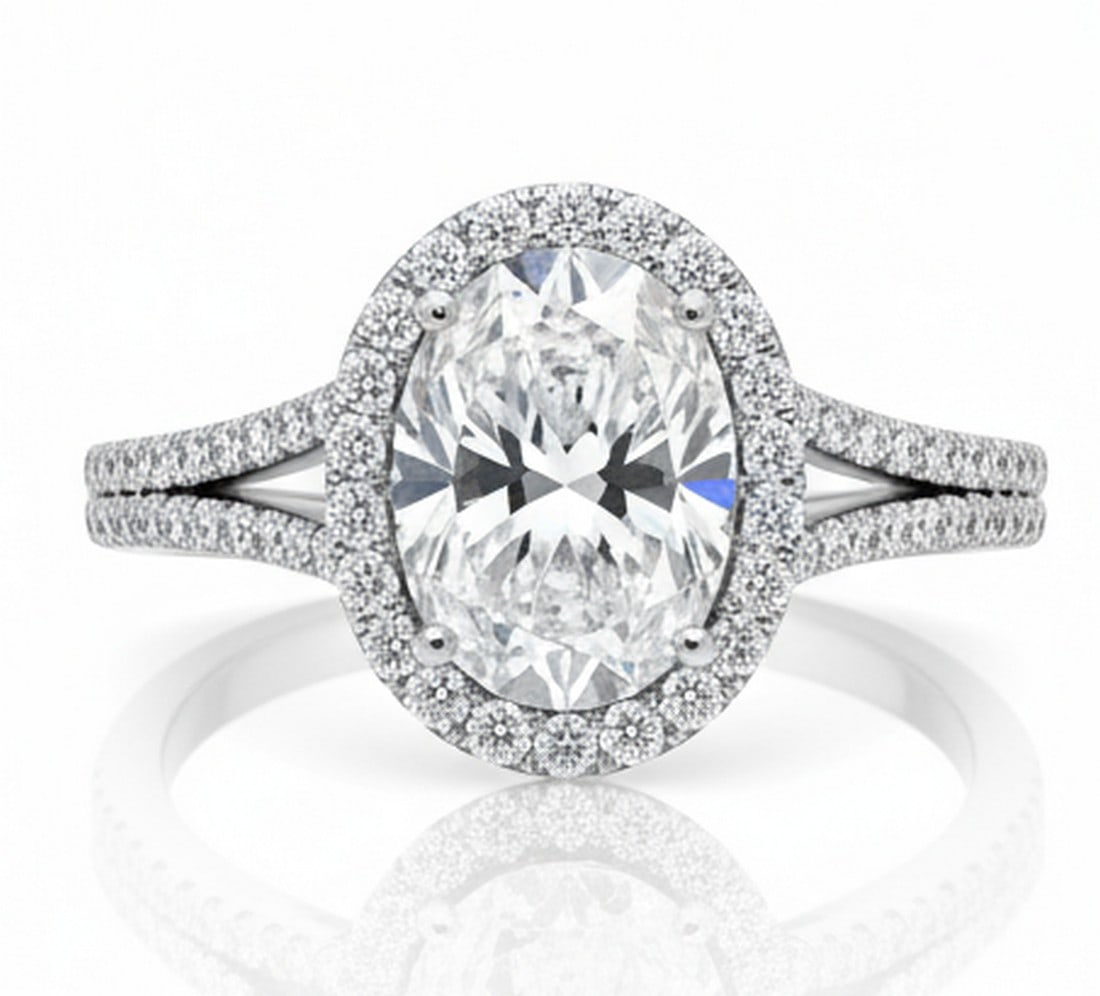 8.00 CT Oval lab-grown diamond Diamond Double-Halo Split-Shank Ring in 14K White Gold: Title: 8.00 CT Oval lab-grown diamond Diamond Double-Halo Split-Shank Ring in 14K White Gold Description: This spectacular ring presents an 8.00 carat oval lab-grown diamond diamond encircled by a dou