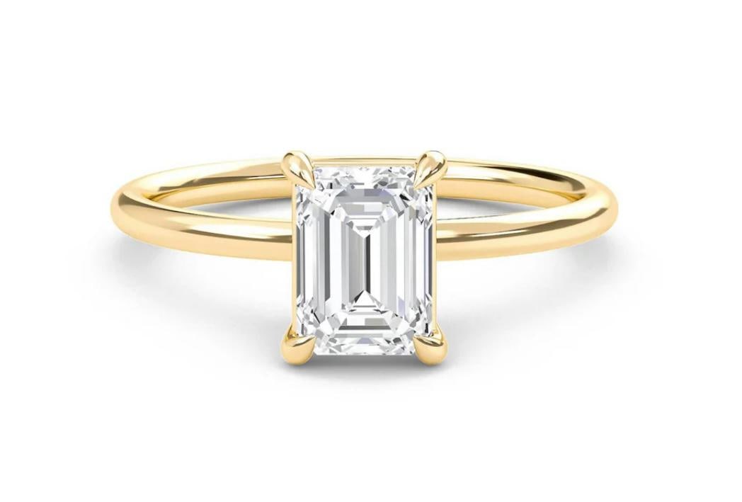 5.00 CT Emerald-Cut lab-grown diamond Diamond Solitaire Ring in 14K Yellow Gold: Title: 5.00 CT Emerald-Cut lab-grown diamond Diamond Solitaire Ring in 14K Yellow Gold Description: This refined solitaire ring features a 5.00 carat emerald-cut lab-grown diamond diamond in a classic