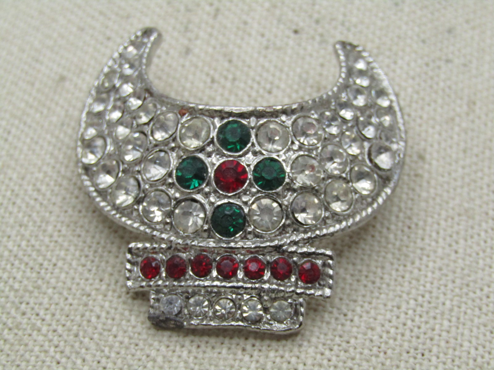 Vintage Shriner’s Fez Crescent Rhinestone Brooch. 1960's-1970's: Vintage Shriner’s Fez Crescent Rhinestone Brooch. 1960's-1970's Vintage Shriner’s Fez Crescent Hat Pinwith clear, red and green rhinestones. Masonic Brooch Shriner Tassel Holder Silver tone and ap