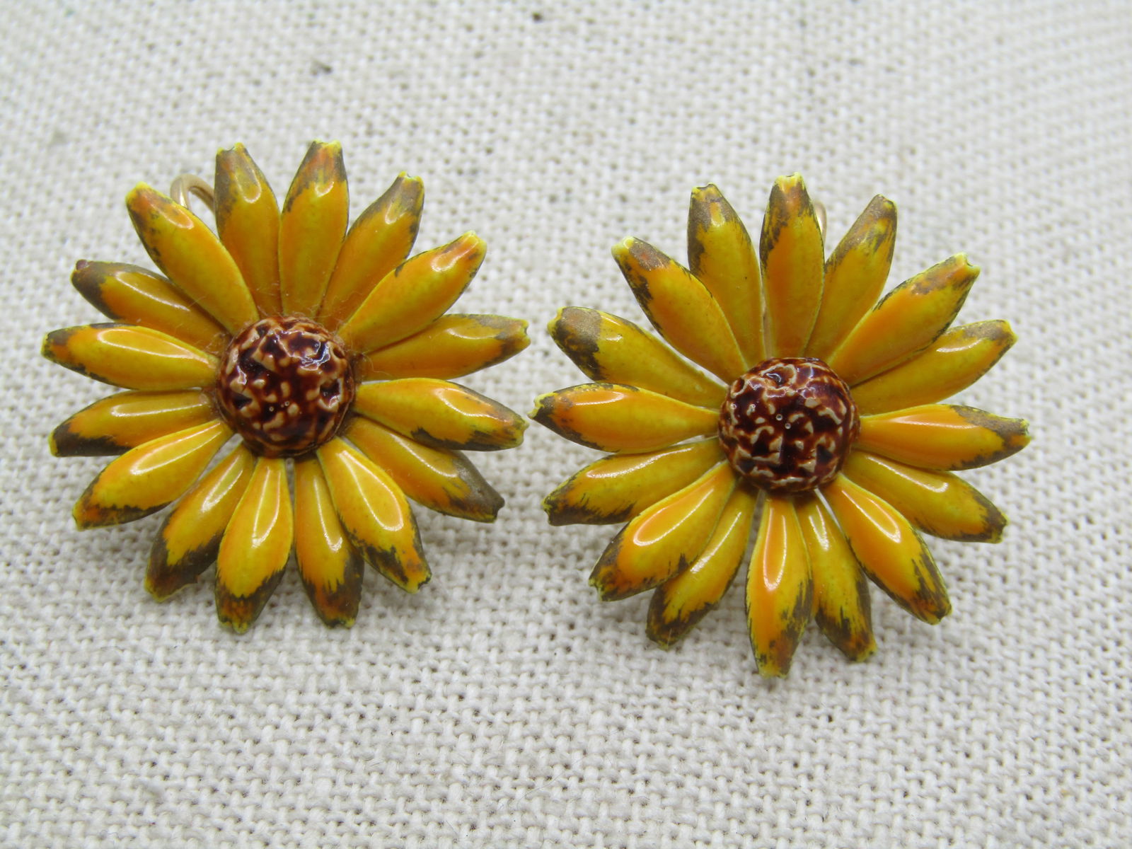 Vintage Yellow Enameled Floral Earrings, Clip, 1960's: Vintage Yellow Enameled Floral Earrings, Clip, 1960's. Yellow blossoms with gold tipped petals and a brown center. They are appx. 1" across. Could be sunflower or some other flower such as a
