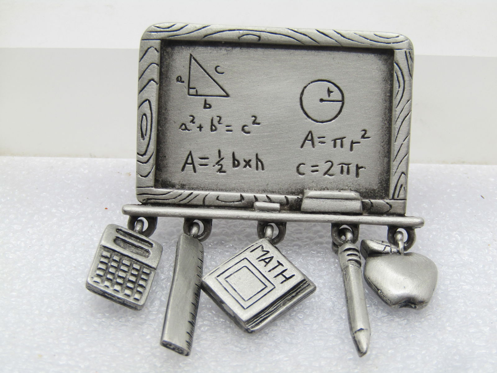 Vintage J.J. Blackboard/formula & Charm Brooch, 1980's-1990's, Signed JJ, Pewter: Vintage J.J. Blackboard/formula & Charm Brooch, 1980's-1990's, Signed JJ, Pewter. It is 2.25" tall and 1.75" wide. woodgrained design framed with ledge that holds the eraser with a design that