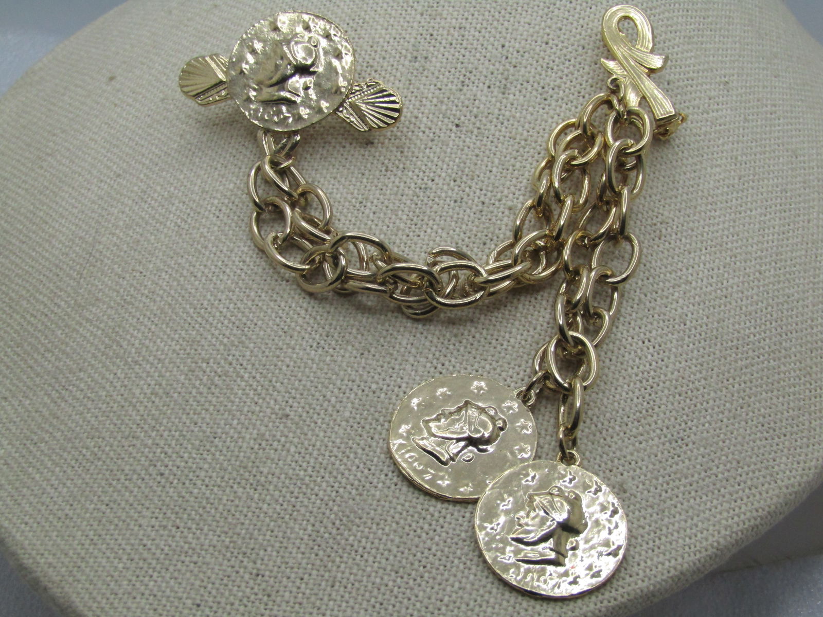 Vintage Faux Coin Double Pin Brooch with Chain, 1970's Statement: Vintage Faux Coin Double Pin Brooch with Chain, 1970's Statement. Simulated Roman style coins. Draping heavy oval link chain that is appx. 8mm wide connects a faux gold tone coin with a raised