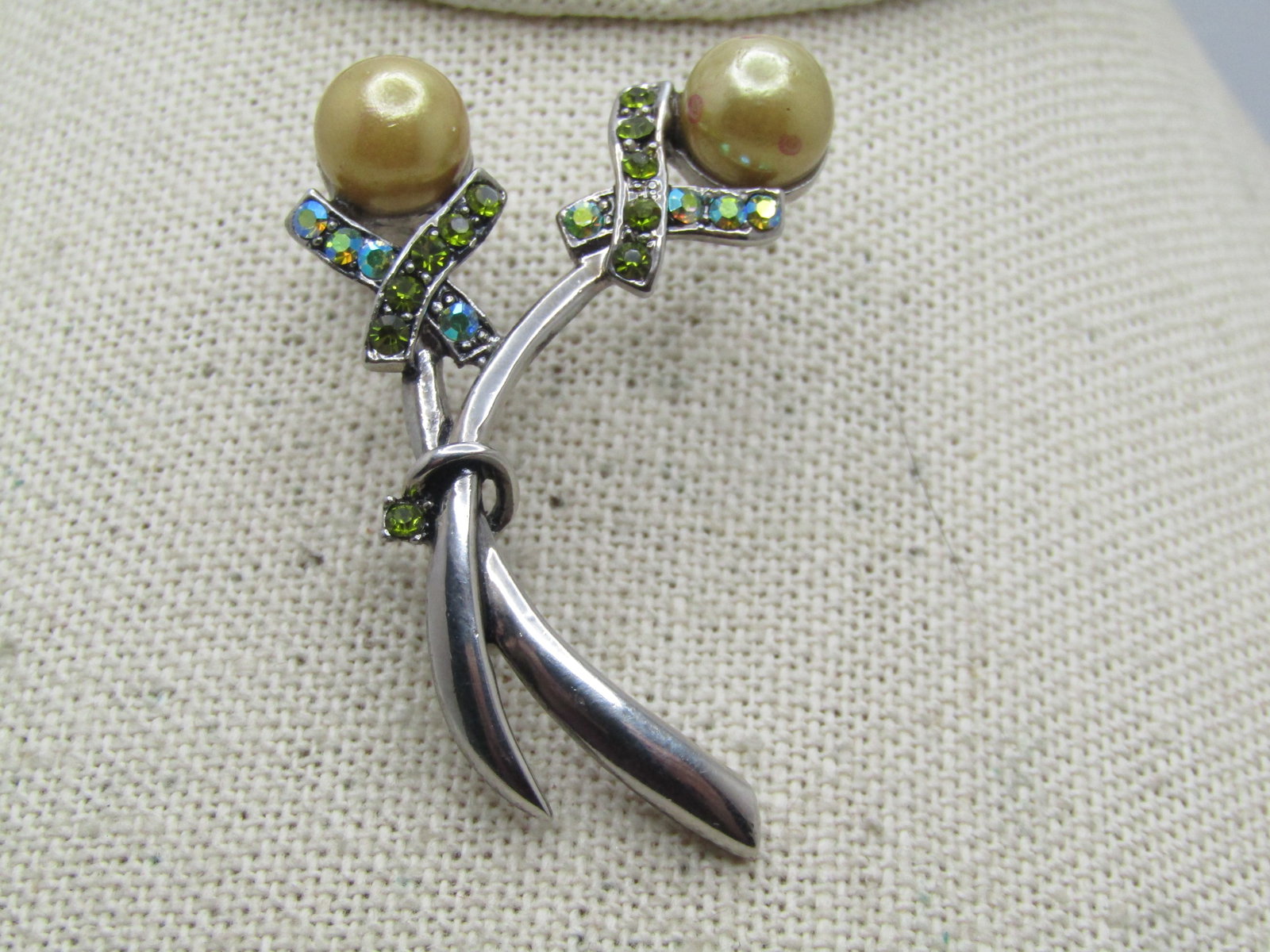 Vintage Fax Pearl Rhinestone Stem Brooch, 1980's, 2": Vintage Fax Pearl Rhinestone Stem Brooch, 1980's, 2". Silver tone double stem brooch - one curved harder than the other and each with a gold tone hued faux pearl that is appx. 8.5mm wide. Under
