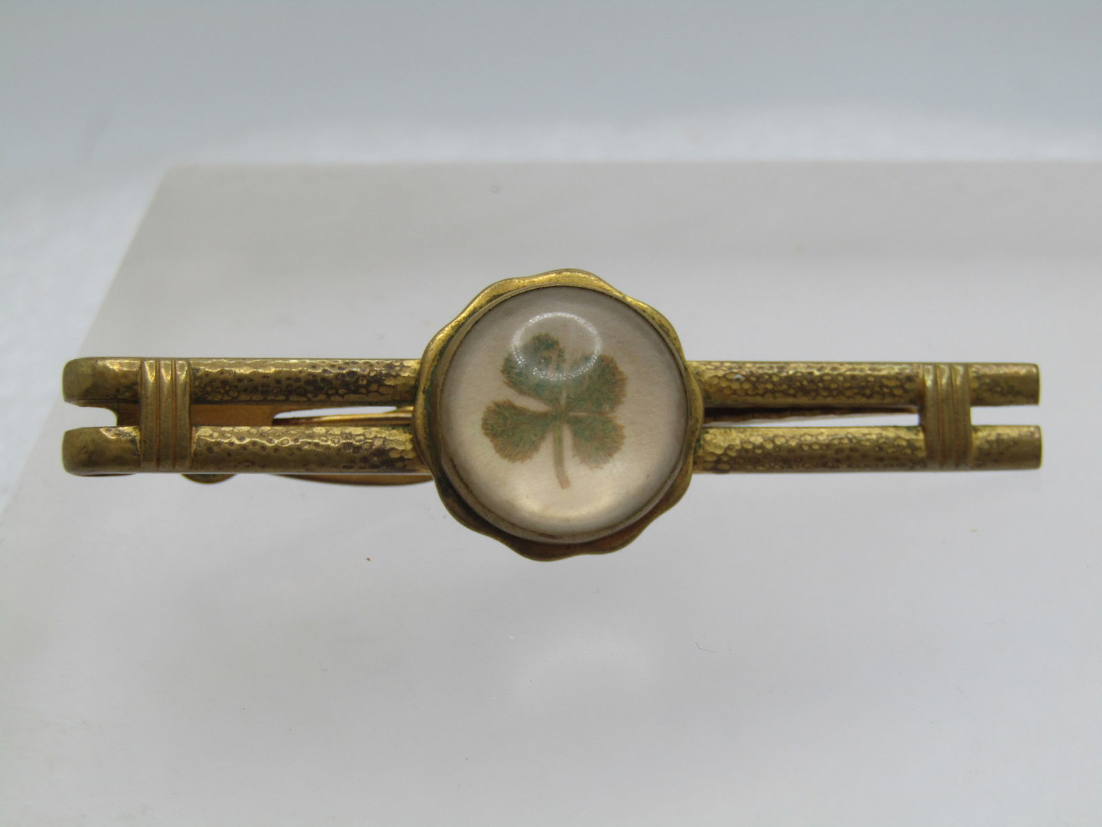Vintage Real 4-Leaf Clover Tie Bar, Signed Hickok, 1940's-1950's: Vintage Real 4-Leaf Clover Tie Bar, Signed Hickok, 1940's-1950's. This has a double bar design with a real four-leaf clover set under glass in a bezel frame with wider base. It is appx. It is appx.