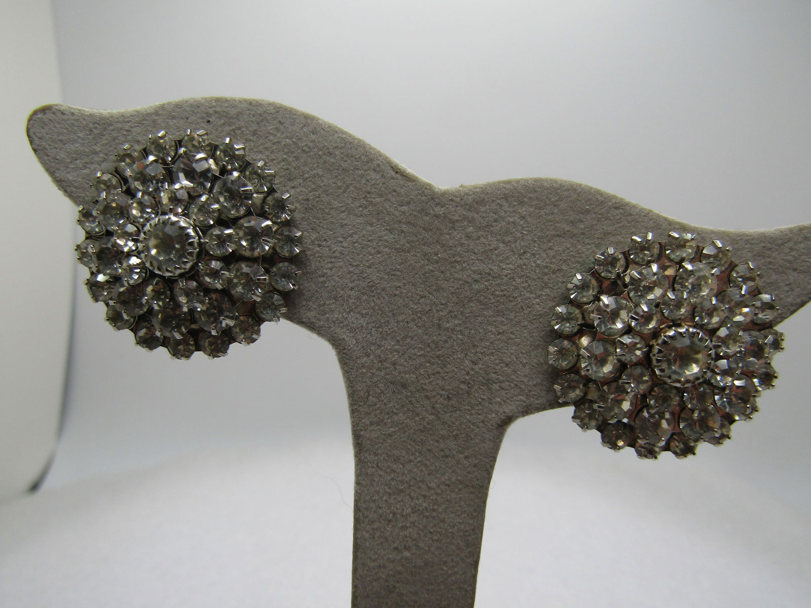 Vintage Clear Rhinestone Blossom Dress Clips, 1940's-1960's, Signed Bluette: Vintage Clear Rhinestone Blossom Dress Clips, 1940's-1960's. Very clean and very clear and bright stones set in four tiers - three halo tiers and a larger center stone that is appx. 5mm round with a