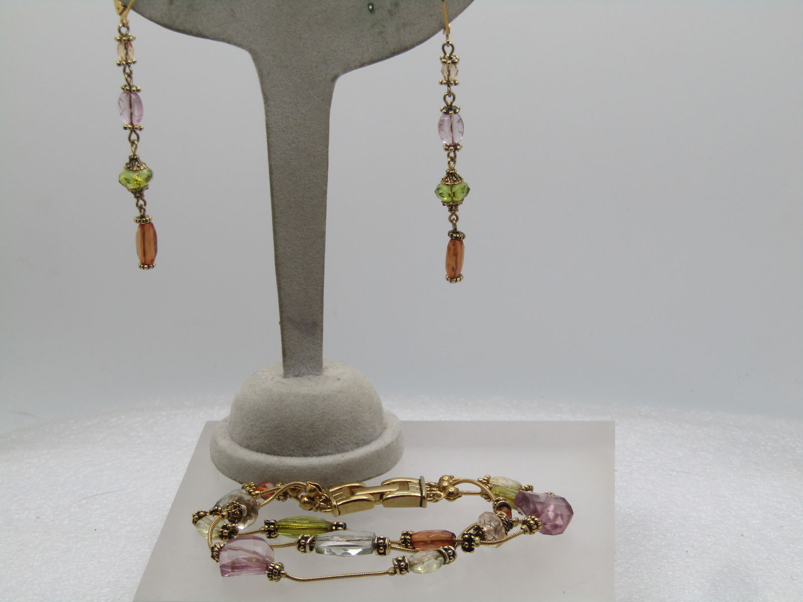 Vintage Triple Strand Crystal Bracelet, Dangle Earrings, Pierced, 1960's-1980's: Vintage Triple Strand Crystal Bracelet, Dangle Earrings, Pierced, 1960's-1980's. Gold tone. Flip clasp on the bracelet. The bracelet is 7.5" with three strands that have a serpentine round chain with