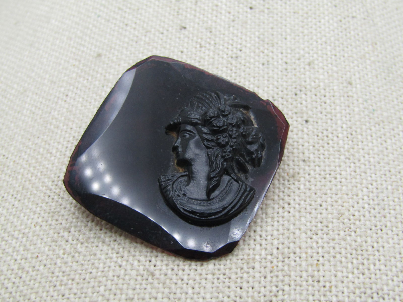 Vintage Czech Amethyst Glass Cameo Brooch, C-Clasp, 1920's: Vintage Czech Amethyst Glass Cameo Brooch, C-Clasp, 1920's. Bevel-edged flat amethyst glass base that is appx. 1.25" sqaure with a raised black glass cameo set on the right side. C-Clasp. Marked