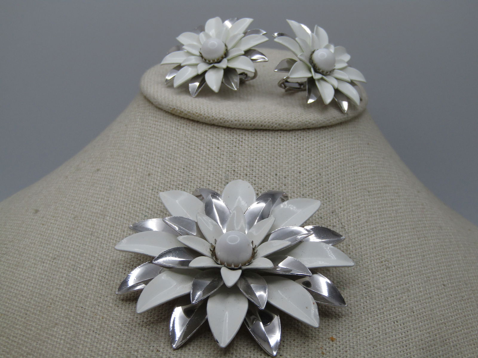 Vintage White & Silver Blossom Brooch & Earrings Set, Clip 1960's-1970's, Sarah Coventry: Vintage White & Silver Blossom Brooch & Earrings Set, Clip 1960's-1970's, Sarah Coventry. White enameled and silver petals on the blossoms with the brooch having four layers of petals and the