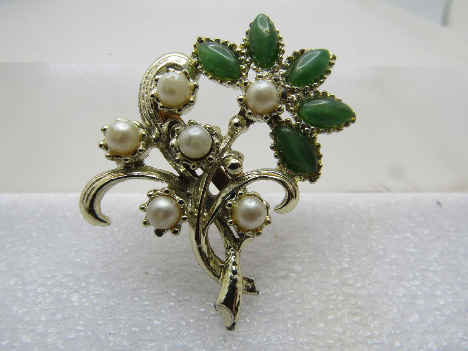 Vintage Green Floral Blossom, Faux Pearls, 1950's-1960's: Vintage Green Floral Blossom, Faux Pearls, 1950's-1960's,. Green petals in the blossom that re appx. 7.5mm by 3mm marquise shaped acrylic stones. Silver tone and appx. 1.5" tall and 1.25" wide. it