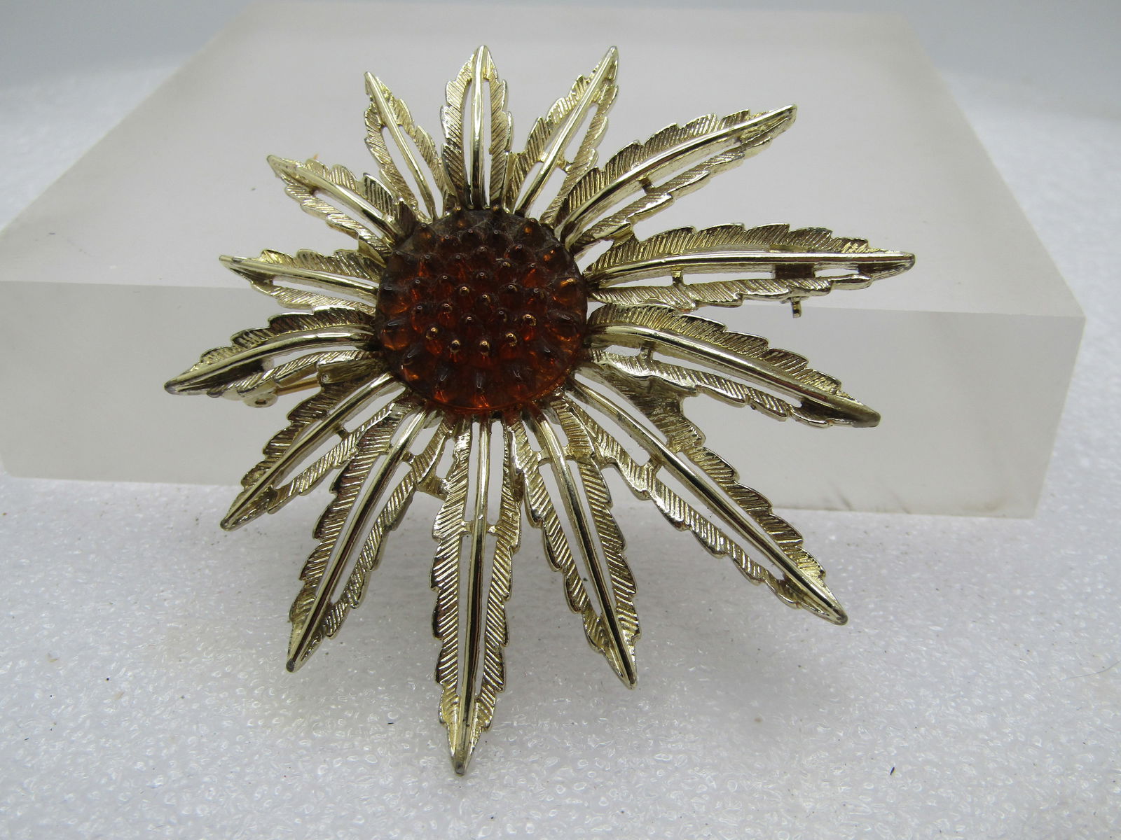 Vintage Blossom Brooch/Pendant, Brown Center, Sarah Coventry, 1960's: Vintage Blossom Brooch/Pendant, Brown Center, Sarah Coventry, 1960's - is it a sunfloer, spider mum - not sure. I've seen it listed as a starburst too. The petals are shorter on one side and longer