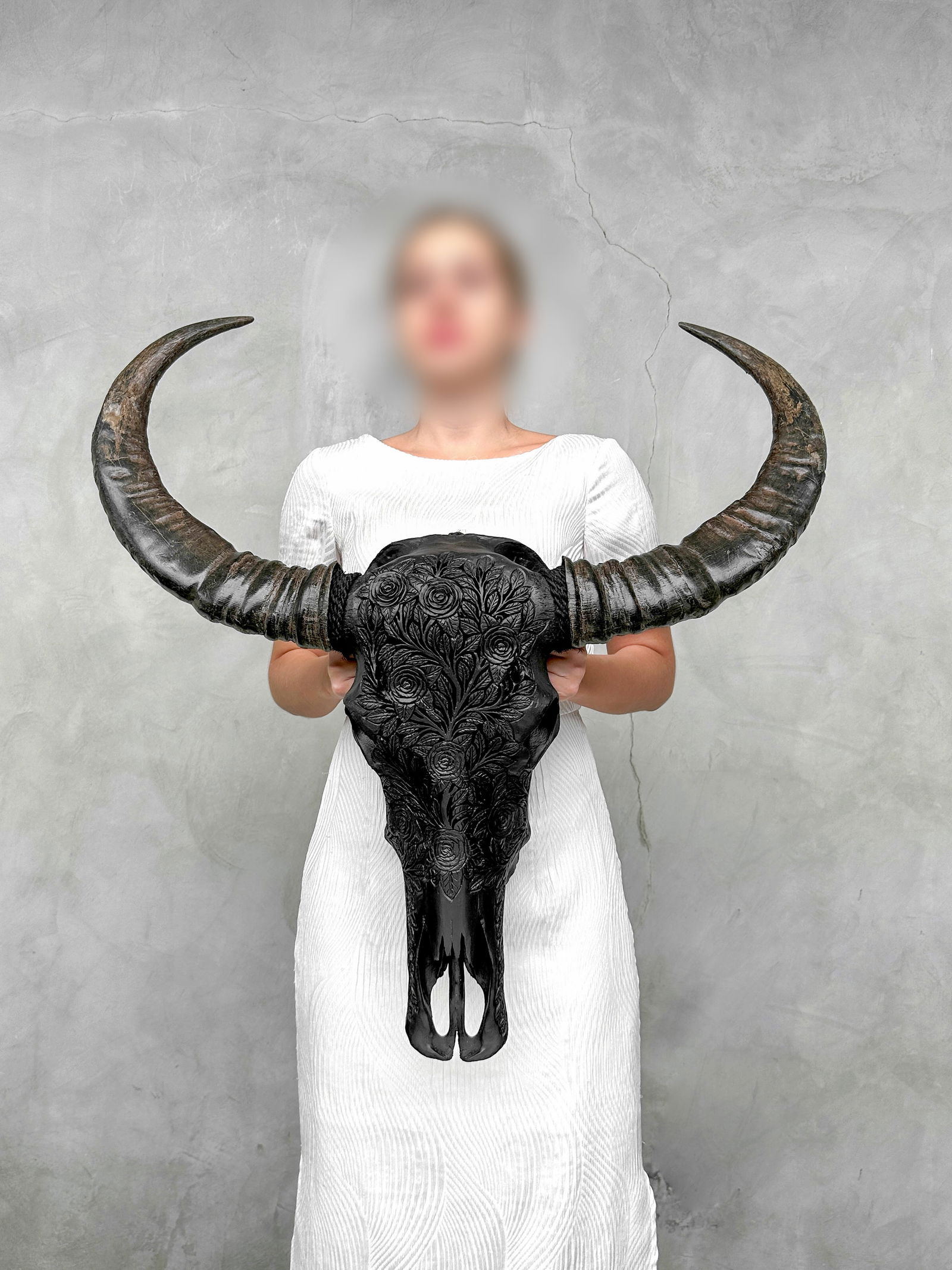 Carved black water buffalo skull - Roses Motif: Title: Carved black water buffalo skull - Roses Motif Maker:Unknown Origin: Indonesia Date/Period:2025 Materials:Bubalus bubalis, Bone, Horn Dimensions:Length: 85 cm / 33.4 inches Width: 76 cm / 29.9