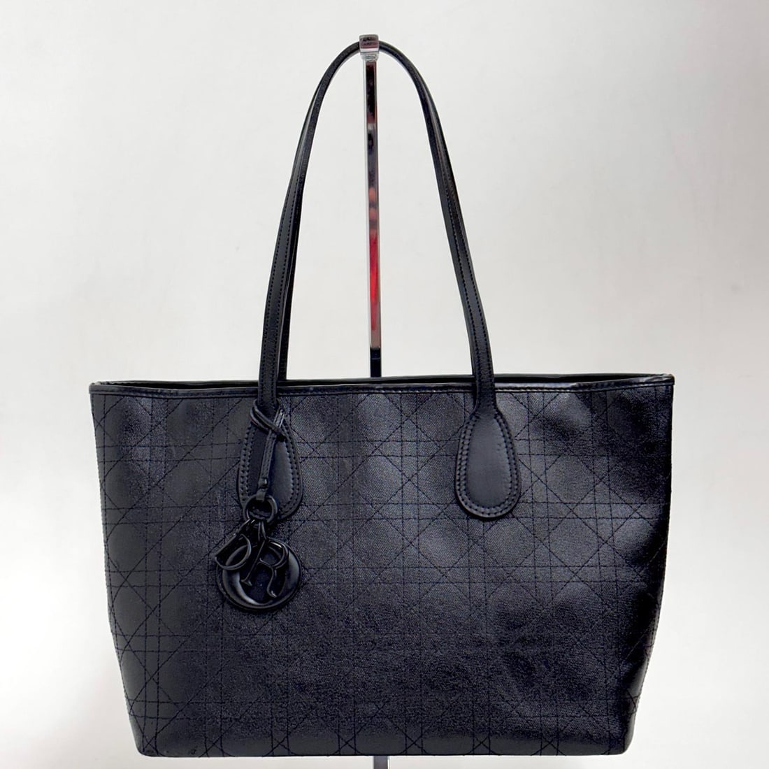 CHRISTIAN DIOR Panarea Tote in Black Cannage Coated Canvas Tone on Tone: Title:CHRISTIAN DIOR Panarea Tote in Black Cannage Coated Canvas Tone on ToneMaterials:LeatherDimension:• Length: 31 x 40 cm• Height: 24 cm• Width: 15 cmDescription:(6145B352). This
