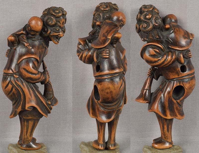 Early 19c netsuke DUTCHMAN with child & trumpet 9.2cm - 2