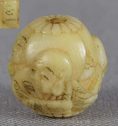 19c marine ojime netsuke slide 4 ARHAT by GYOKUICHI: 19th century small marine material ojime (slide bead for tightening the cord going from netsuke to inro) carved in the round with four arhat - the original disciples of the Buddha identifiable by