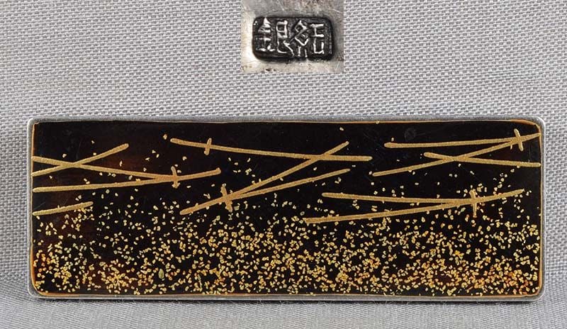 1910s silver & lacquer OBIDOME netsuke PINE NEEDLES: Unusual late Meiji to early Taisho (1910s) Japanese silver and lacquer obidome (sash ornament) with gold lacquer decoration of pine needles. Obidome is worn on an obi cord that holds the obi sash