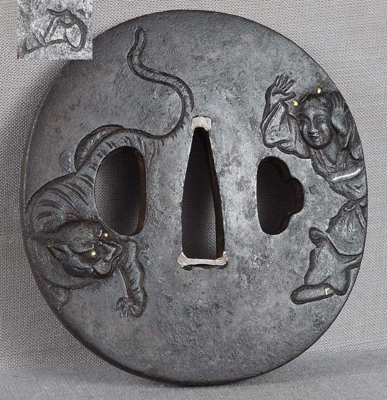 18/19c Japanese sword TSUBA filial piety YOKO & TIGER signed: 18th to early 19th century iron Japanese sword tsuba worked in low relief with a scene of a boy trying to scare an alert tiger. The subject is a legend of Yoko - one of the paragons of filial virtue.