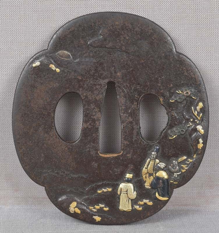 18c Japanese sword TSUBA SCHOLARS VIEWING MOON: Late 18th to early 19th century Japanese sword iron tsuba decorated on the front with 3 scholars and an attendant under a pine tree viewing the moon partially obscured by the clouds. There is yet