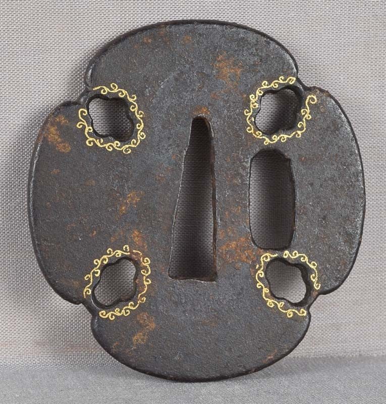 18c Japanese sword tanto TSUBA golden scrolls: Late 18th to early 19th century tanto iron Japanese sword tsuba with four cutouts surrounded by gold inlaid scrolls. Great design, nice feel of age, some rusting, overall in good condition. Height 2