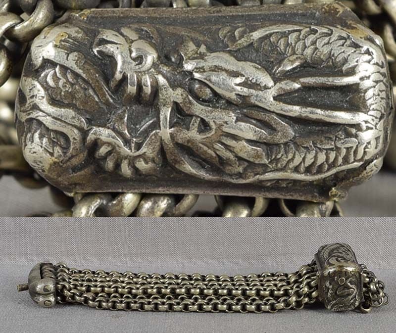 19c netsuke / pouch DRAGON CHAIN: 19th century metal chain used to connect a tobacco pouch to netsuke, its fitting depicting a ferocious dragon in pursuit of the Precious Jewel among swirling clouds. Very nice crisp work, beautiful pa