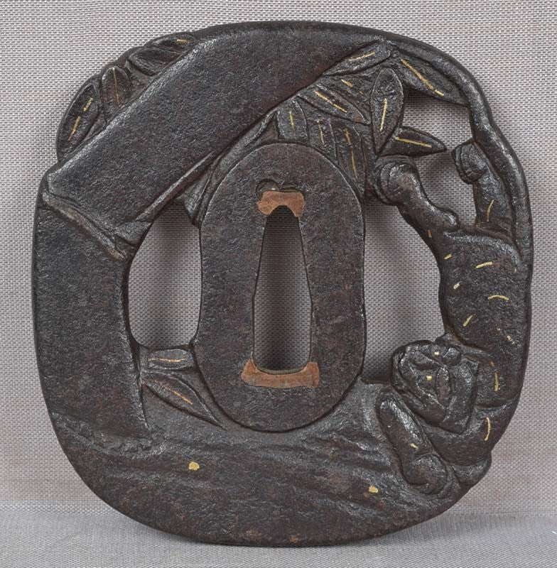 18c Japanese sword TSUBA TIGER & bamboo: 18th century Japanese sword iron tsuba with pierced decoration of a tiger frolicking by a thick stem of bamboo with leaves, 2 sides presenting back and front views. Delightful design, good work,