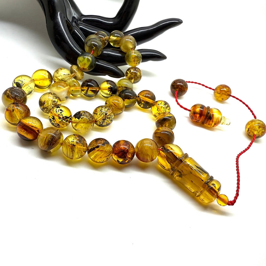 Unique and Exquisite Amber Tesbih made from Round Amber beads: Title:Unique and Exquisite Amber Tesbih made from Round Amber beads Metal:None Gemstone:Amber Weight:36.6 g Size:Bead size: 11.0 mm Bead size: 0.433 inches Made of:(Reconstituted Amber or Whole Stone)